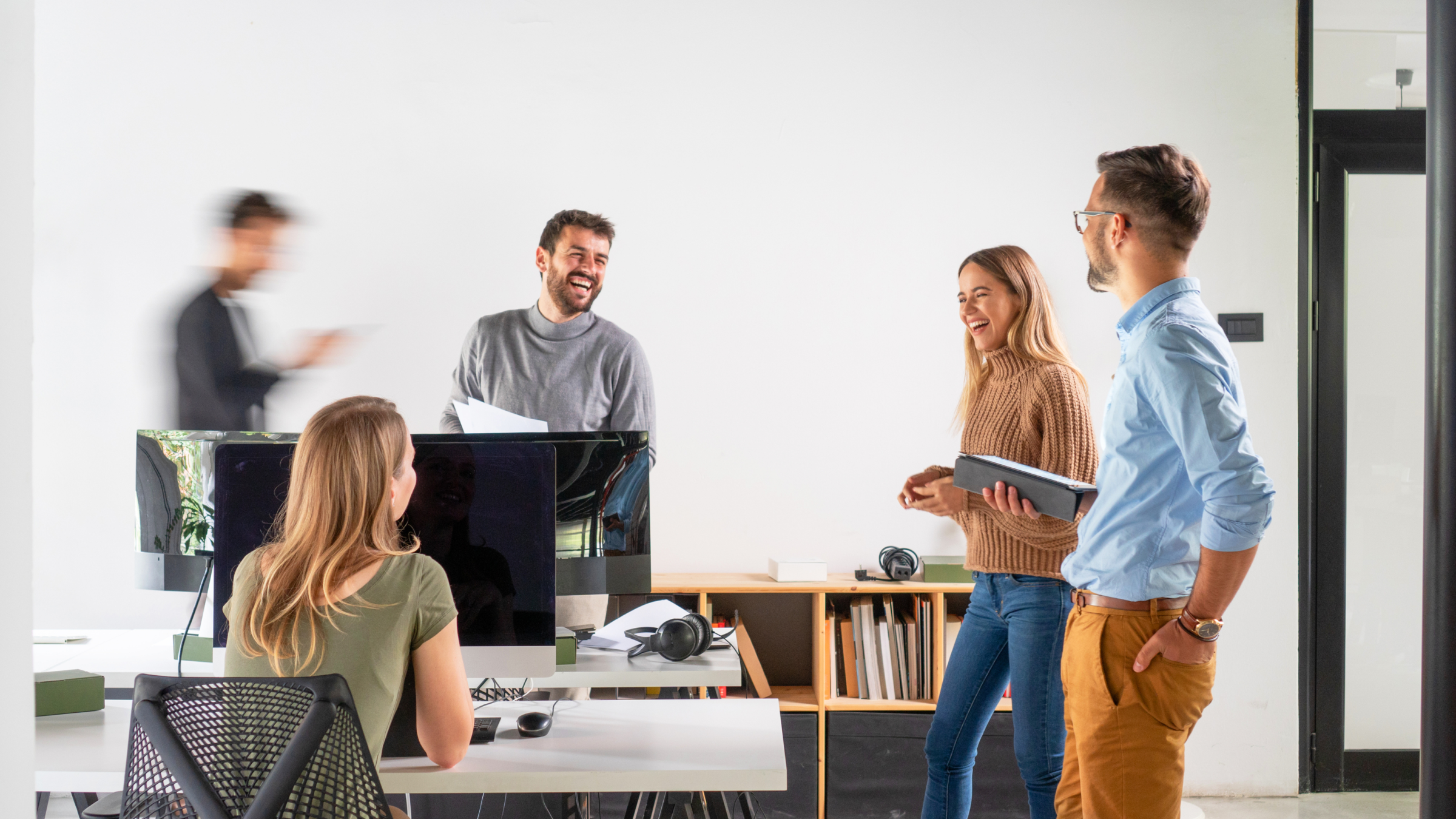 Featured image: A group of employees talking to each other.  - Read full post: 6 Reasons to Invest in IT Support for Your Business