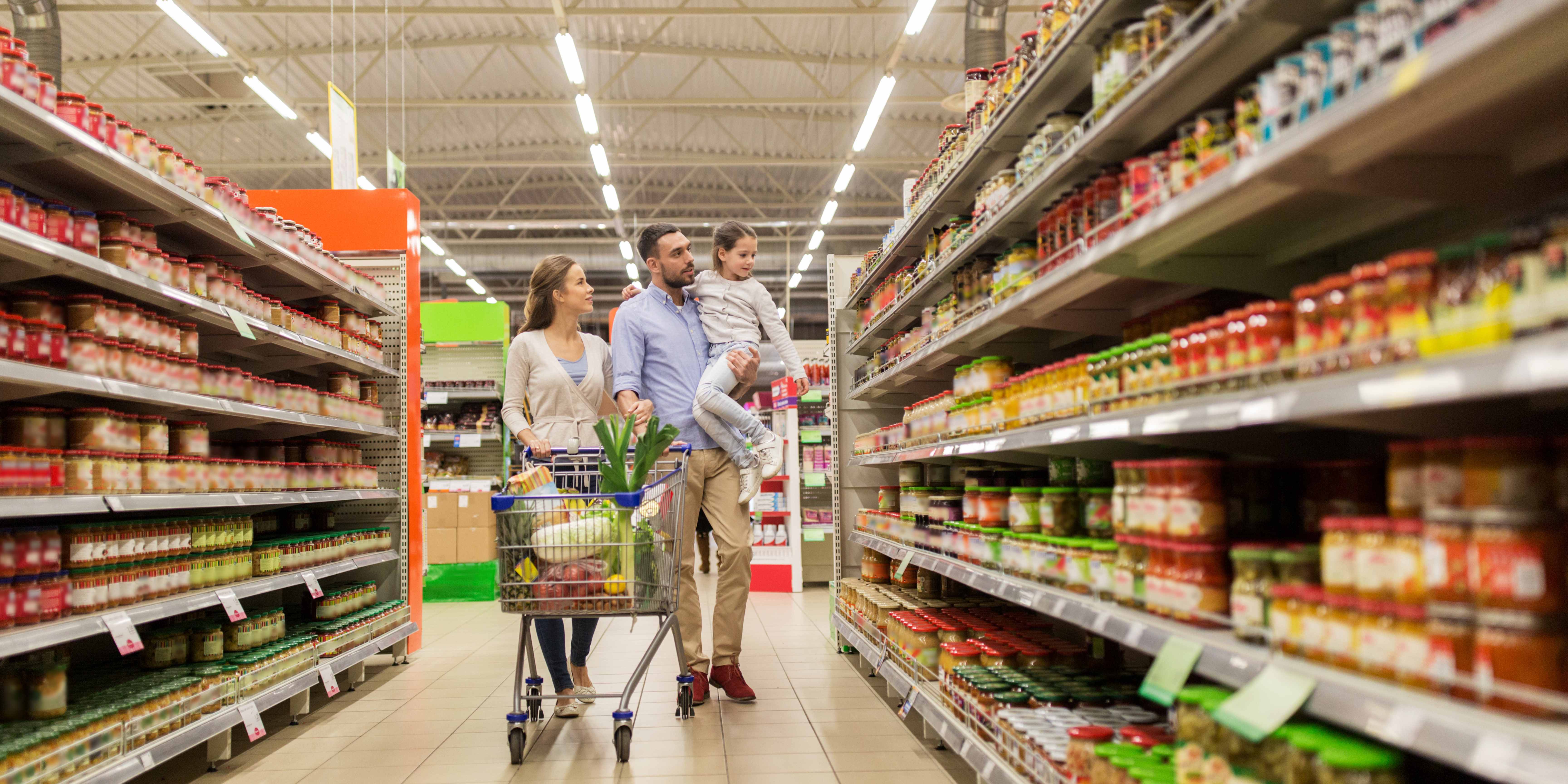 A family of three at the grocery store.